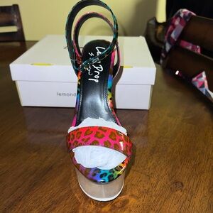 Platform colorful straps around the ankle shoes.